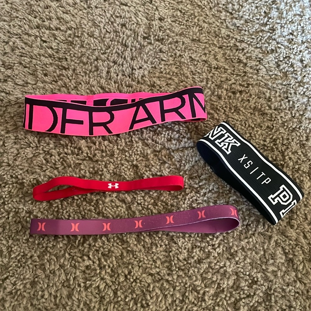 Three ladies Under Armour headbands and a Pink XS band